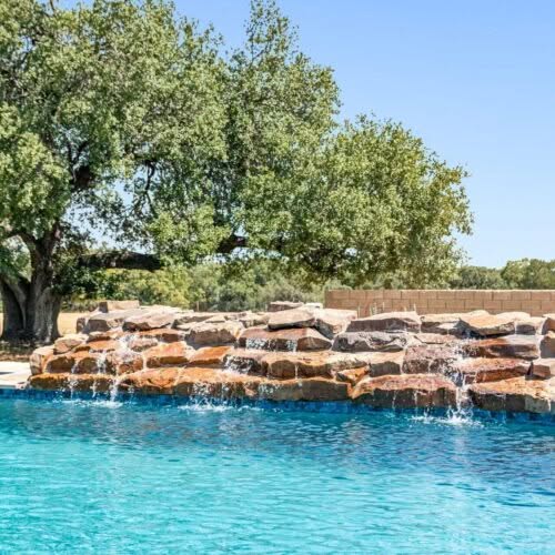 Aquanauts Custom Pool & Spa Waco Tx - Water Spill Over Rocks Custom Pool Caperton